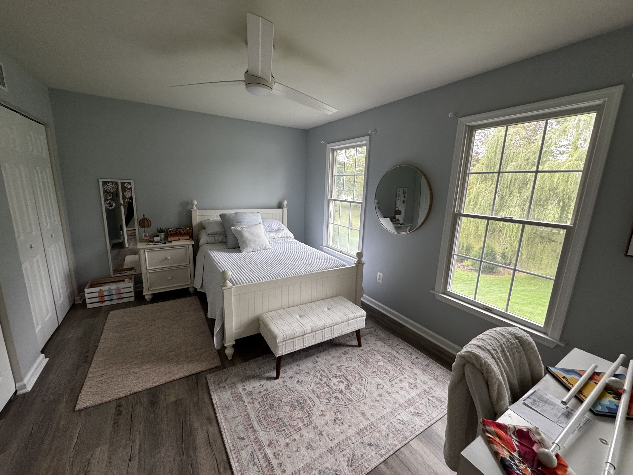 Completed bedroom with gray walls, white ceiling and window trim at Francesca’s Collegeville home